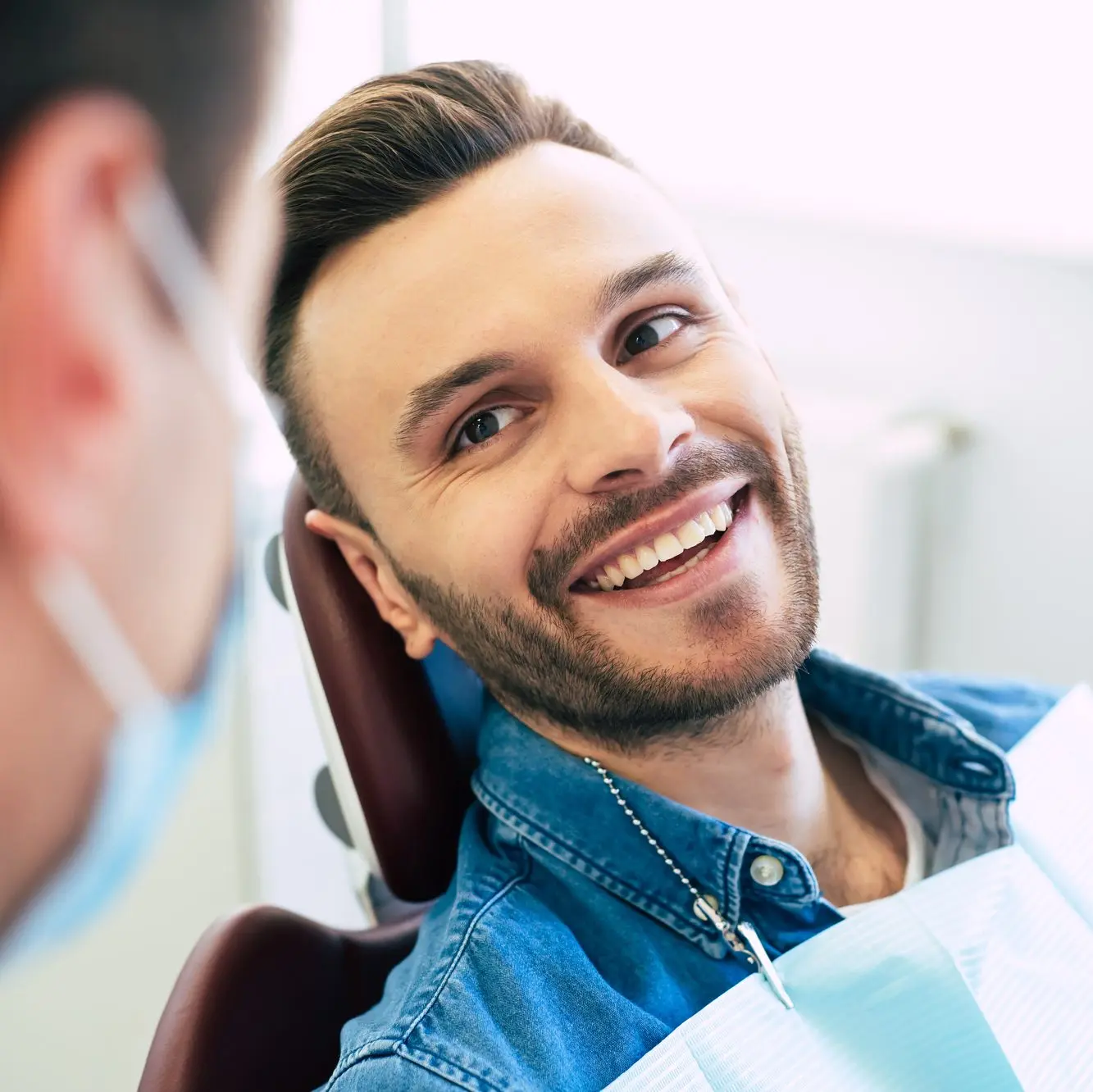 Man smiling while at the dentist